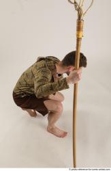 KEETA KNEELING POSE WITH SPEAR